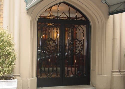 A door with a wrought iron design on it