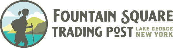 Logo for Fountain Square Trading Post, Lake George, New York, with a hiker silhouette in a circular landscape