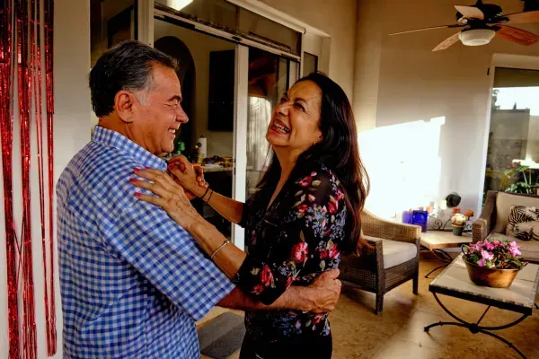 Couple celebrating after online tax preparation