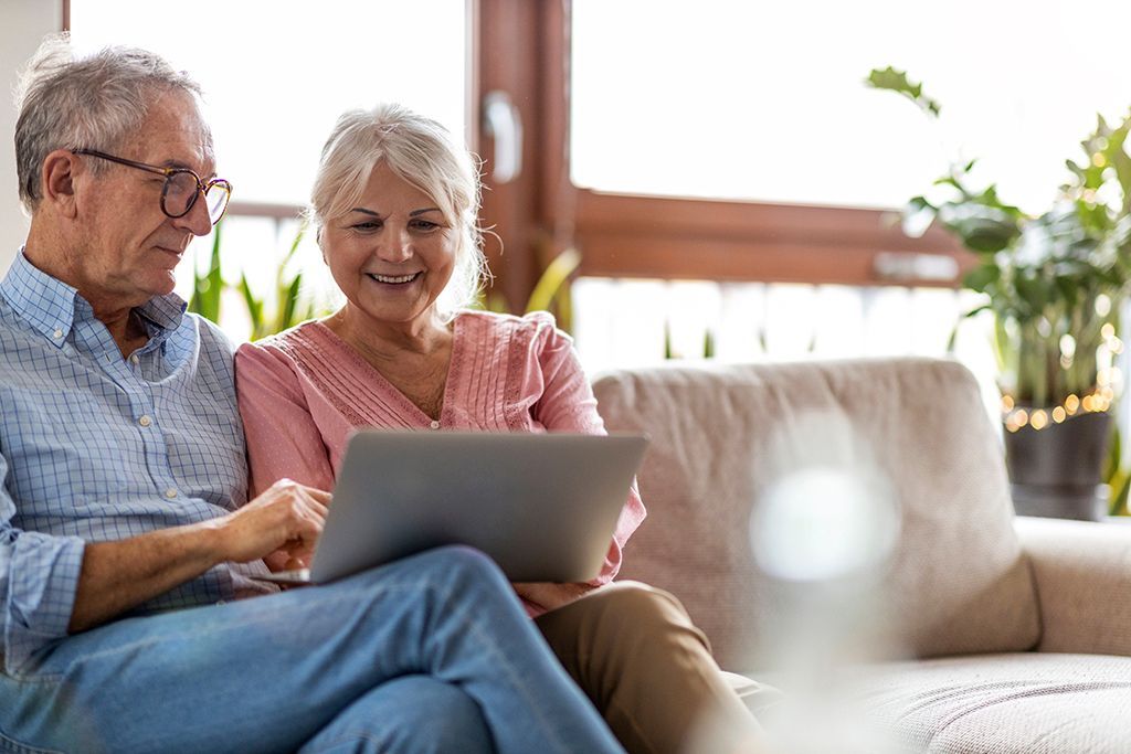 retired couple attend virtual annuity surrender session