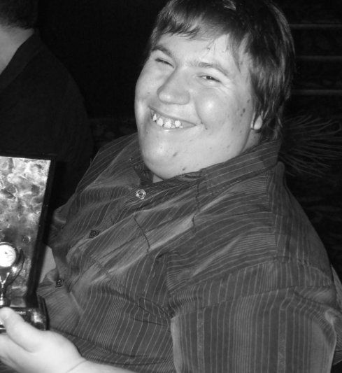 Black and white photo of a male client smiling
