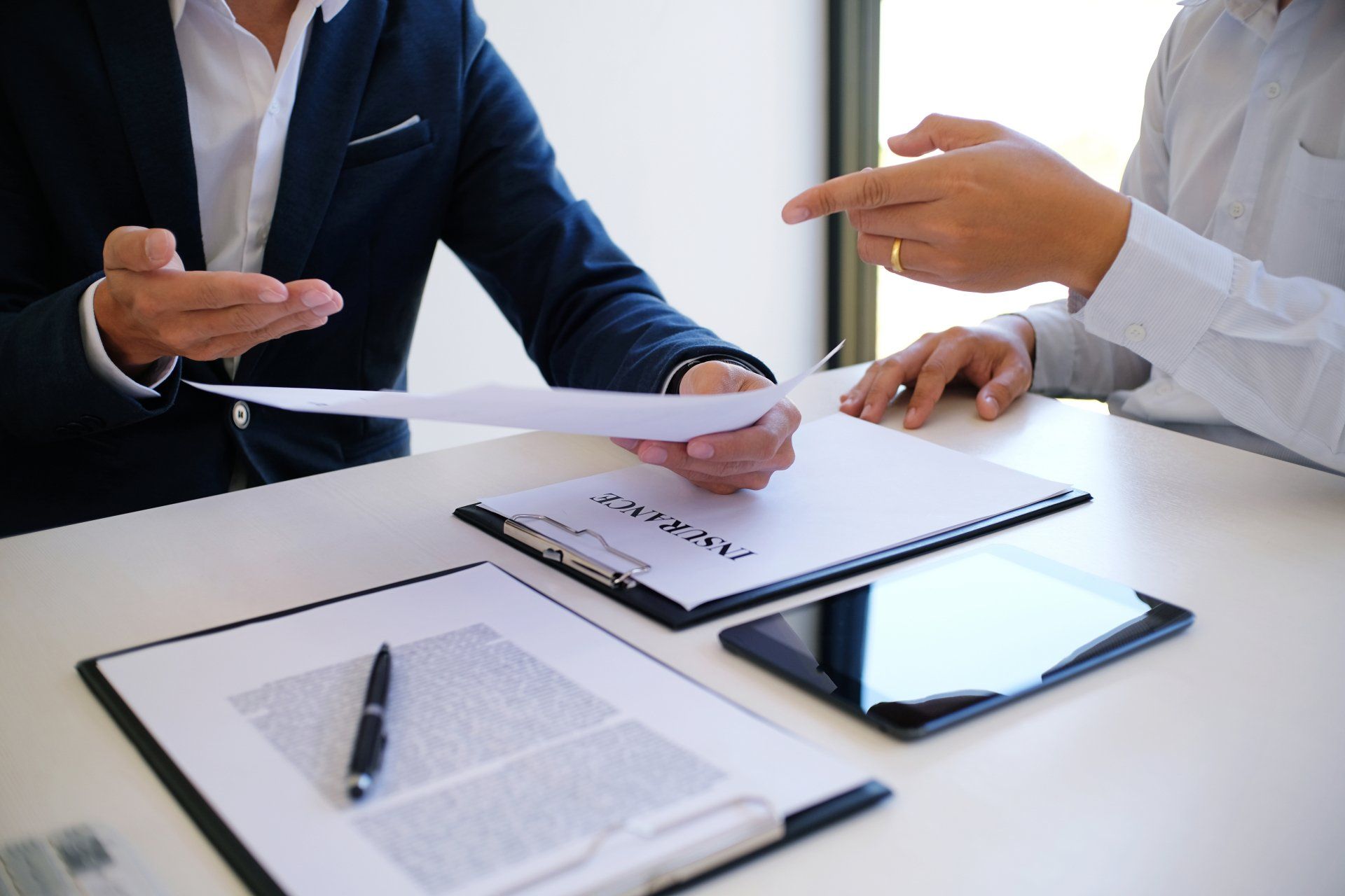 The car dealer provides advice on loans, insurance details