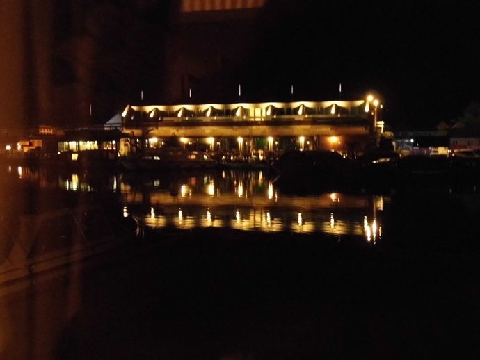 Night view of Wroxham Hotel from living room window of Wherry Cottage