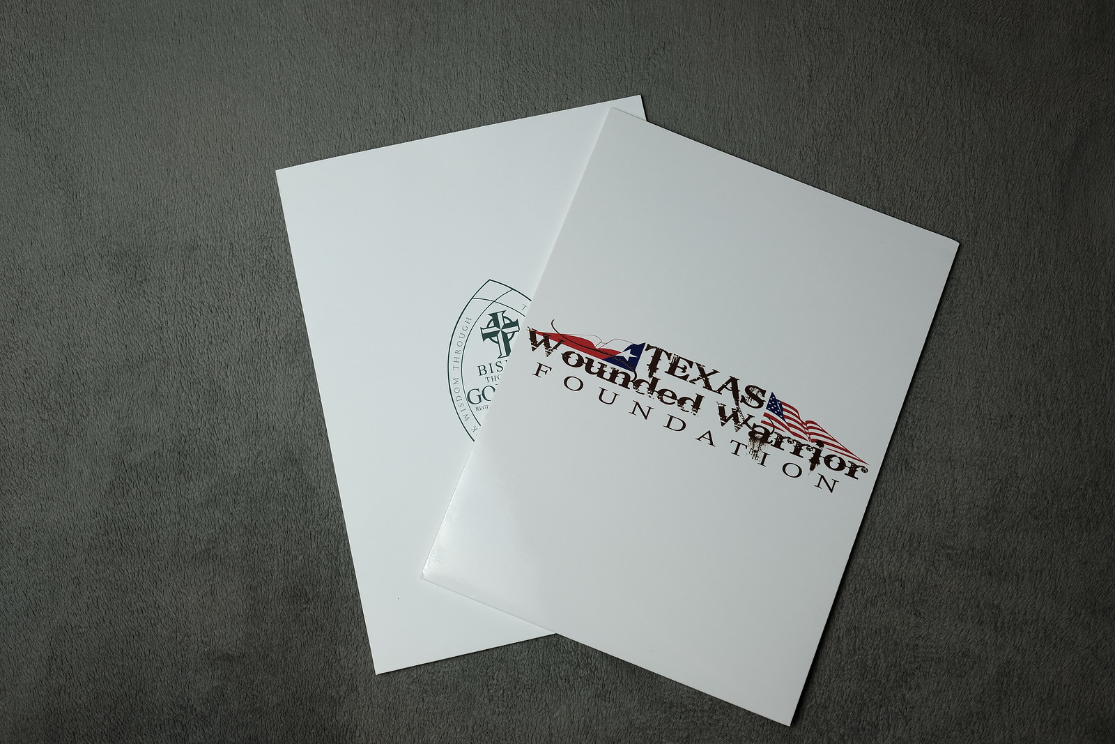 Two white brochures: The Texas Education Foundation logo is printed on the front. One is open.