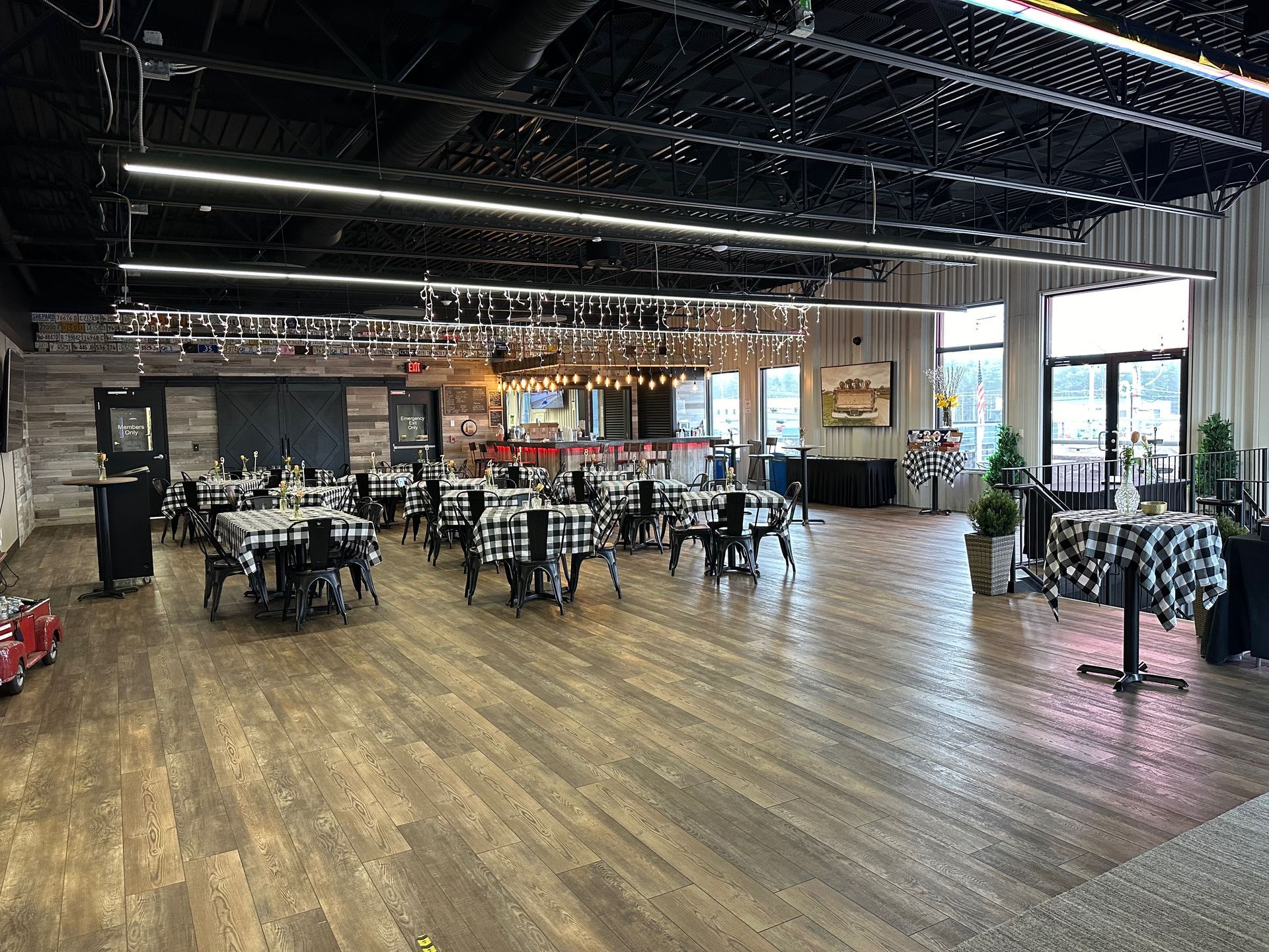 A large room filled with tables and chairs in a restaurant.