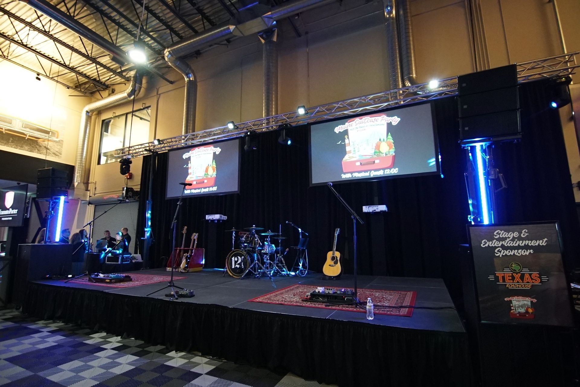 A stage with a guitar on it and a sign that says ' congratulations ' on it