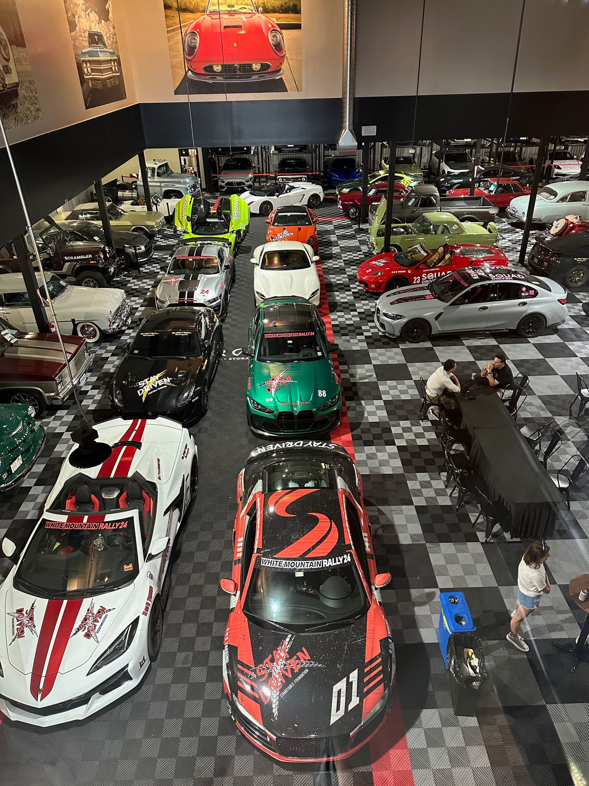 A lot of cars are parked in a garage.