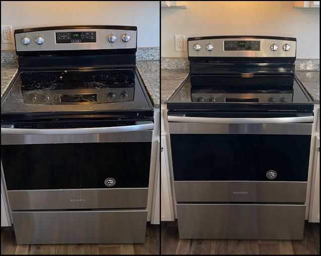 Side-by-side stainless steel ovens with black glass doors in a kitchen.