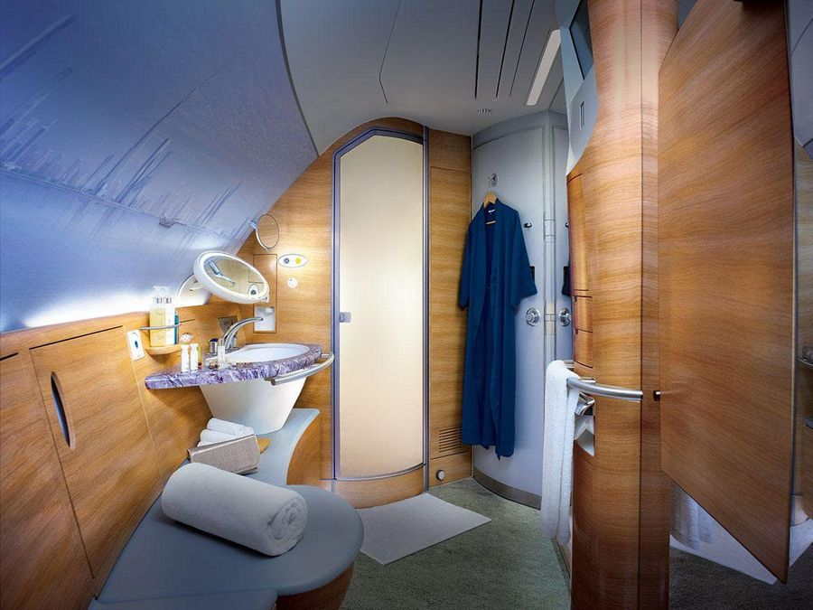 Emirates First & Business Class suite – lie-flat bed and private cabin, bookable from the UK with xLuxuryFlights.com