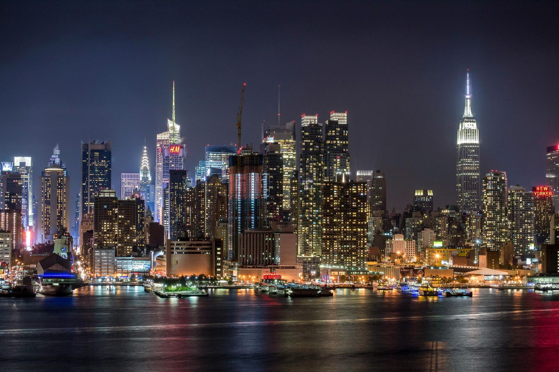 Manhattan skyline at night in New York City, a 5-star city destination ideal for premium First & Business Class Flight + Hotel packages - xLuxuryFlights.com