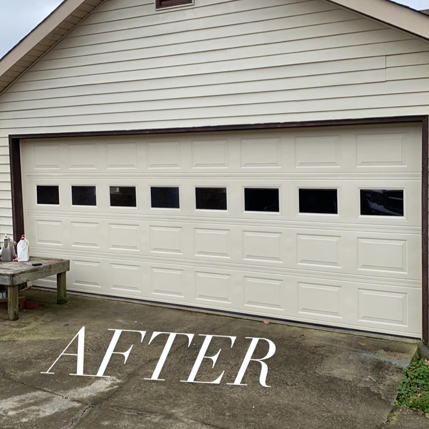 White garage door with rectangular windows on a house, labeled “AFTER” on the driveway.