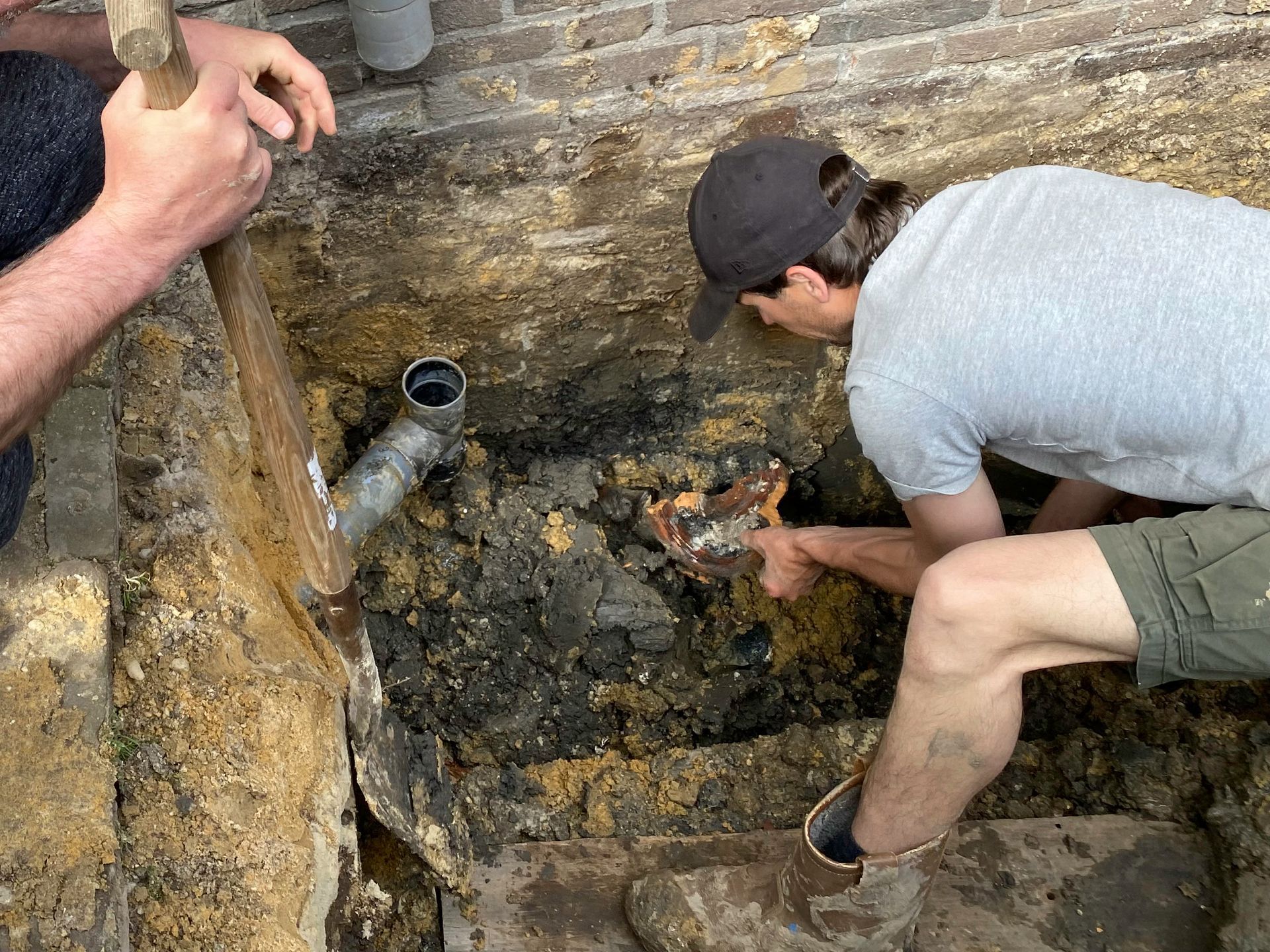 A technician from Rooter Express is providing sewage line repair in Lansing, MI.