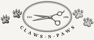 Claws-N-Paws logo with scissors and paw prints in black and white