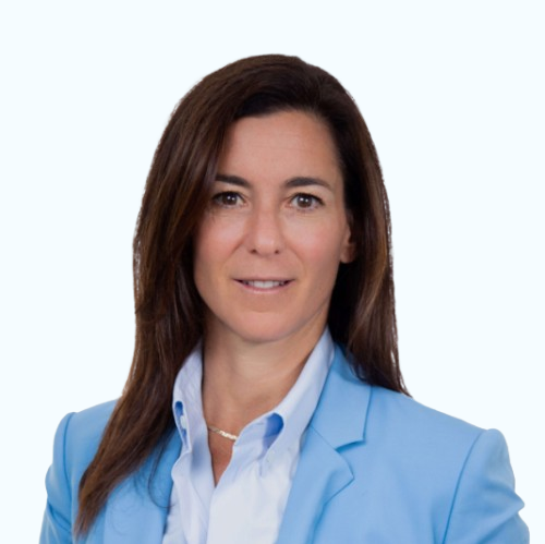 Headshot of a woman in a light blue blazer and white shirt on a white background