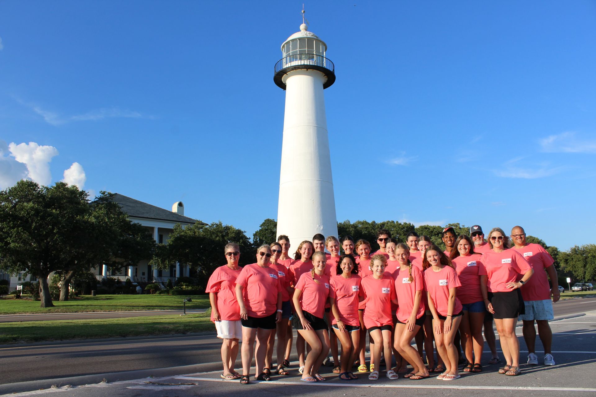 Youth Mission Trip team 2025 in front of lighthouse.