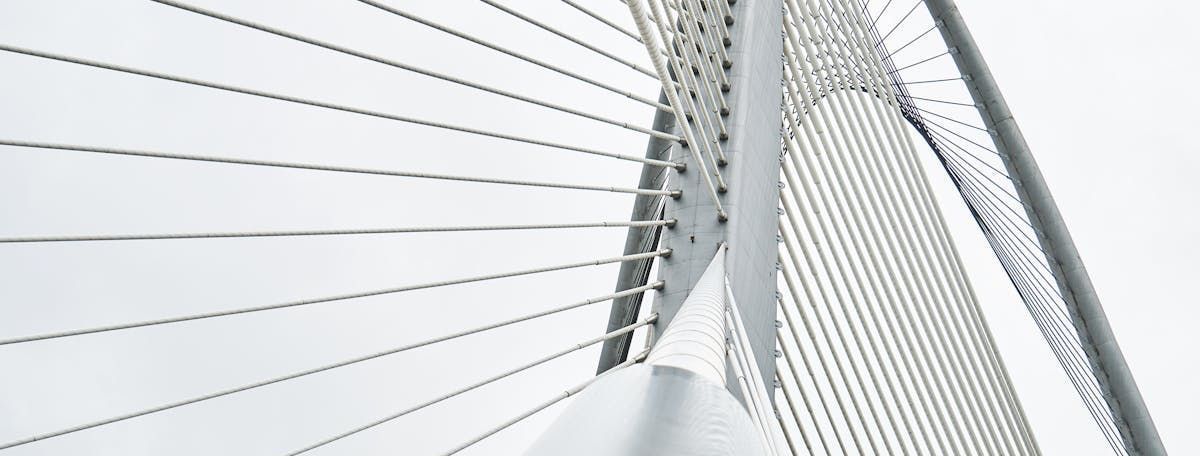 A close up of a ferris wheel with a white background.