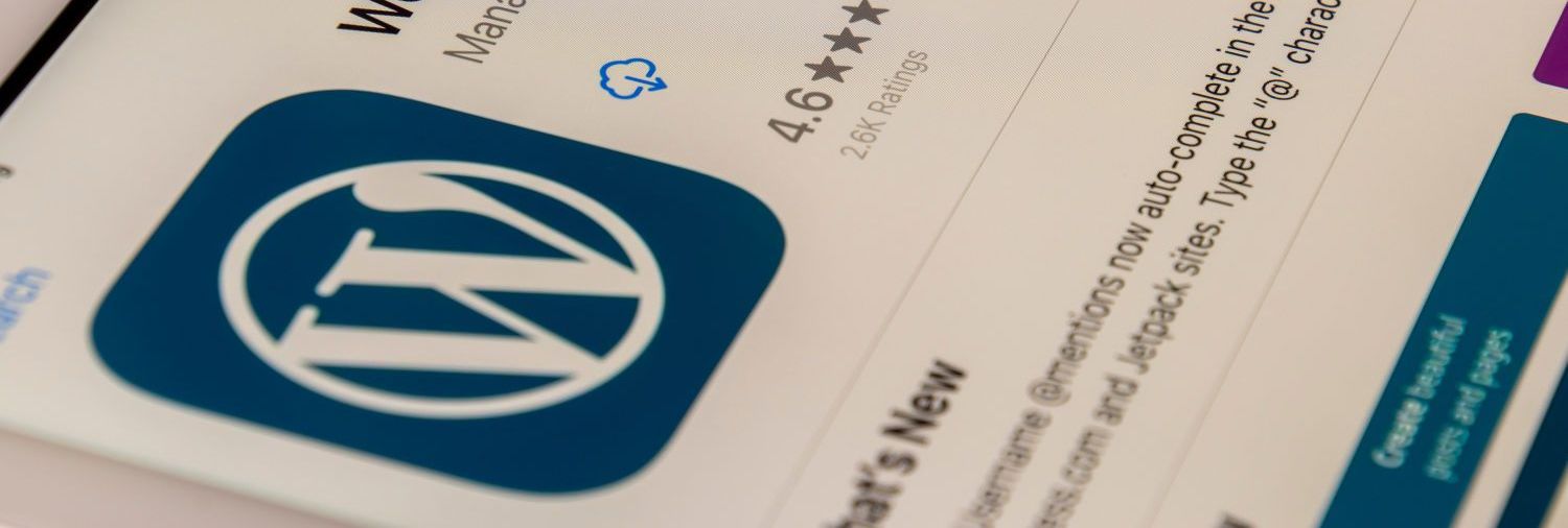 A close up of a cell phone with a wordpress app on it