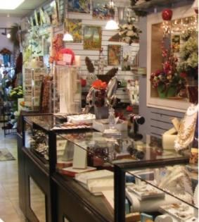 Flower and gift shop interior with glass display cases and colorful floral arrangements
