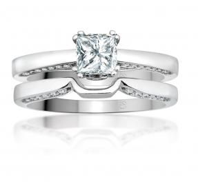 Silver engagement ring with a square-cut diamond on a white background