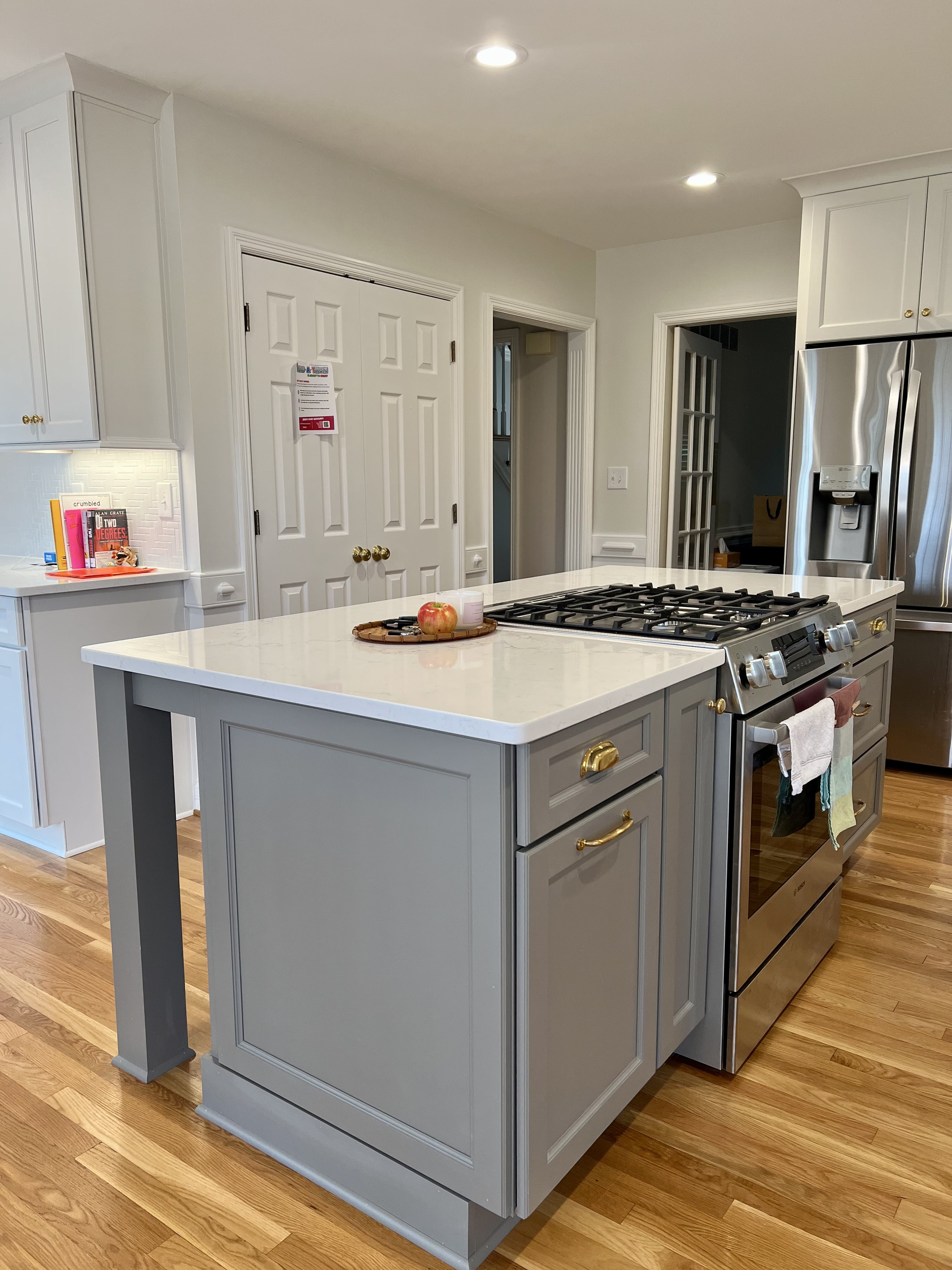 There is a large island in the middle of the kitchen.