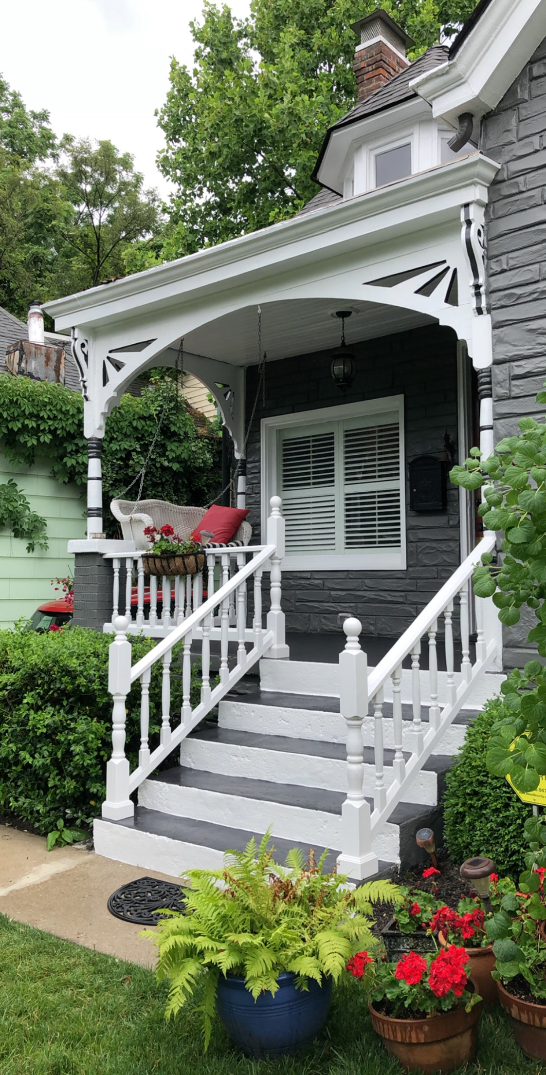 There is a porch with stairs leading up to it.