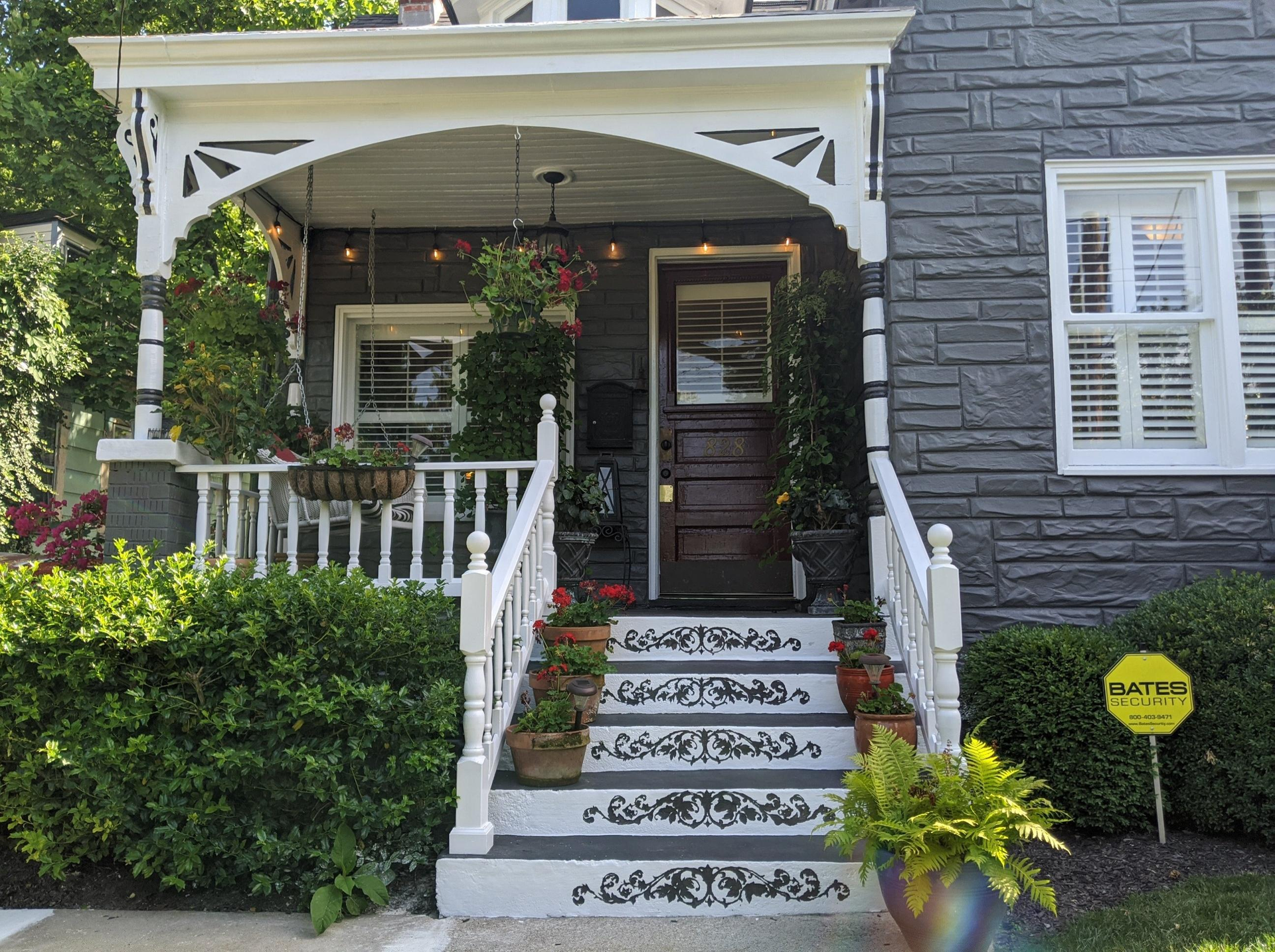 A house with a porch and stairs is for sale.