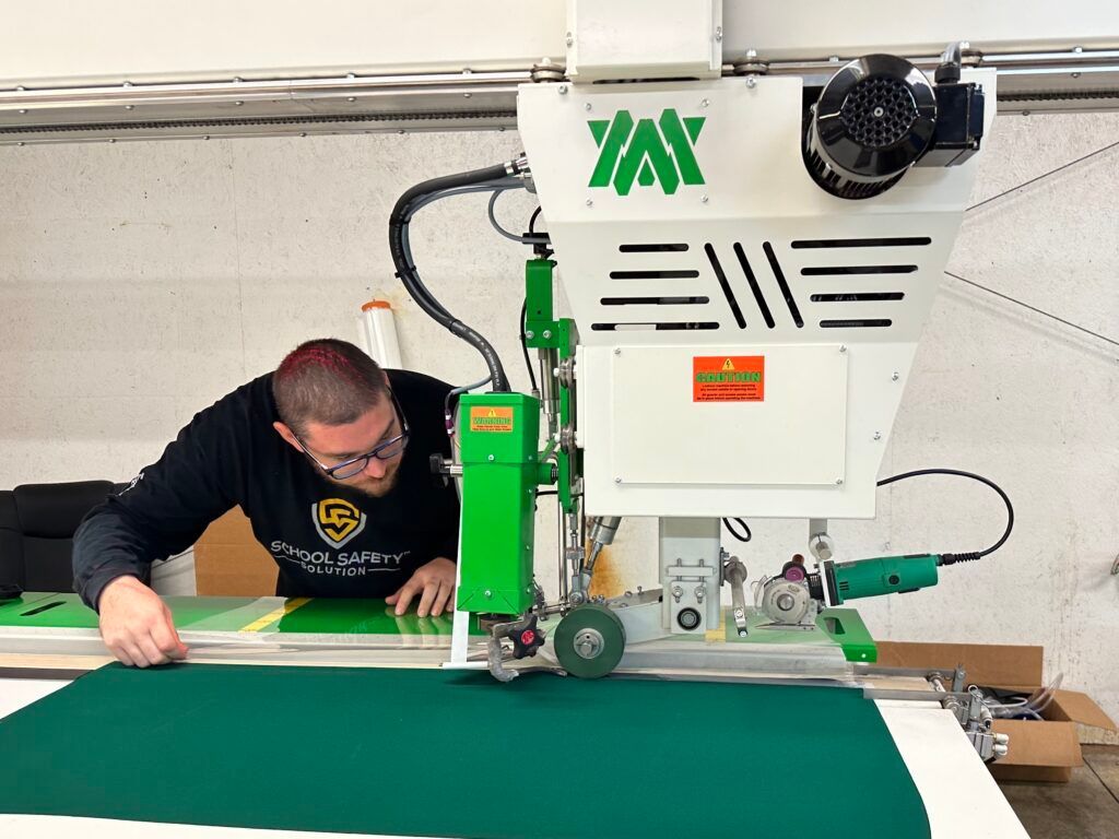 A man is working on a machine that is used for RF welding.