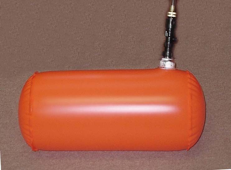 A large orange cylinder with a hose attached to it.