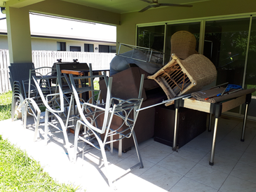 Bunch of Chairs and Tables Are Stacked on Top of Each Other on a Patio — Rob's Rubbish Removal in Tweed Heads West, NSW