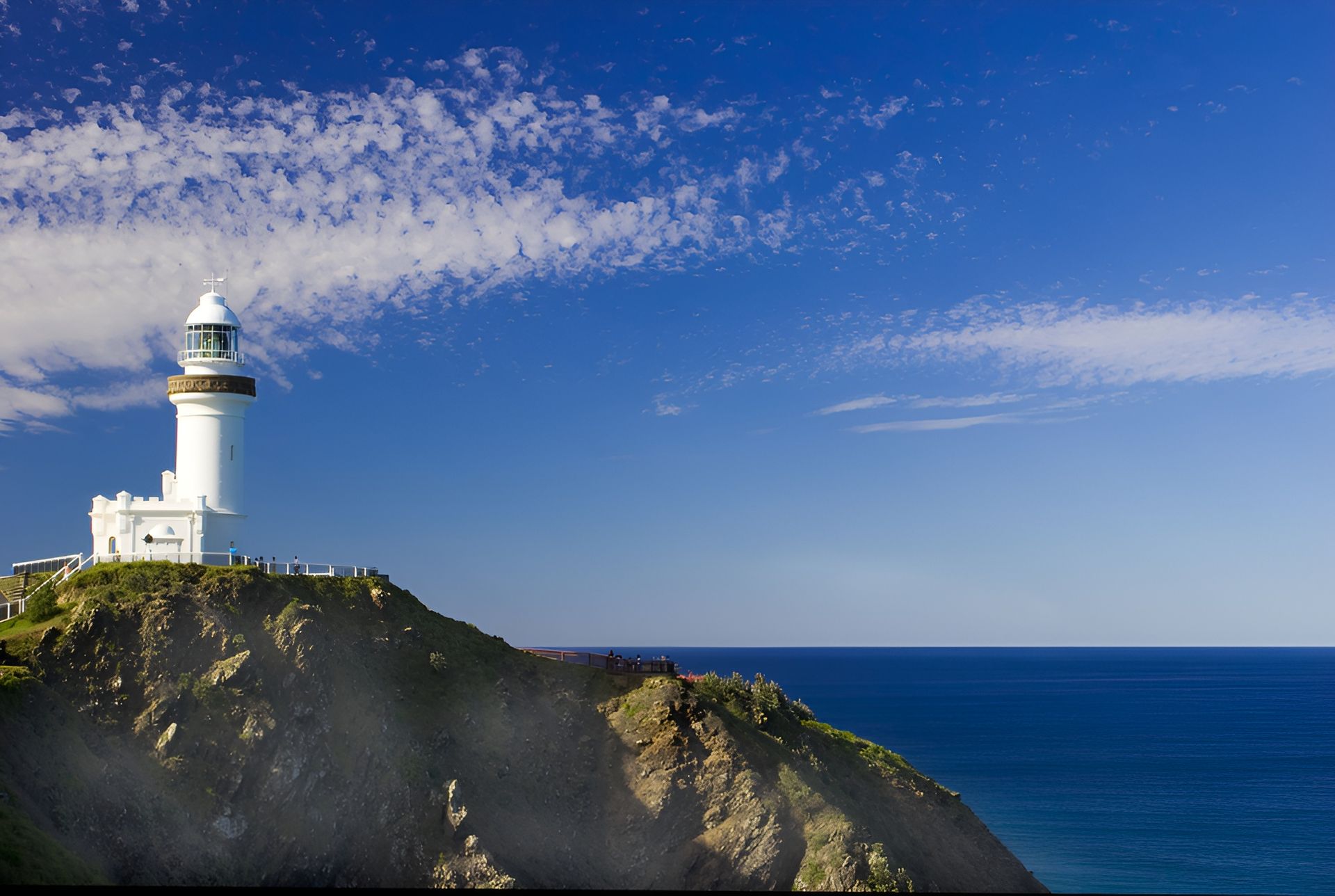 White Lighthouse Atop a Cliff Overlooking — Rob's Rubbish Removal in Byron Bay, NSW