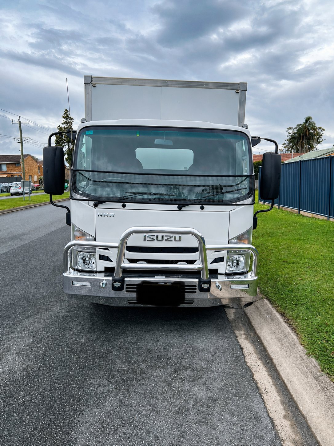 Moving Truck is Parked on the Side of the Road Next to a Ramp — Rob's Rubbish Removal in Tweed Heads West, NSW