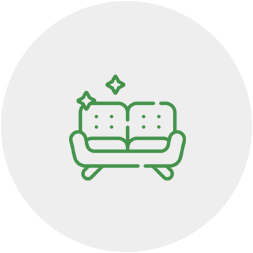 A green line drawing of a couch with a star on it.