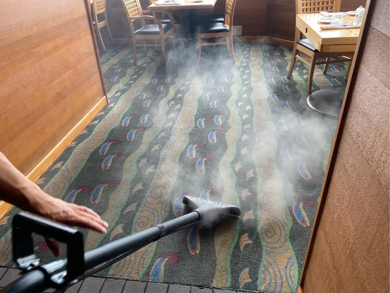 Professional carpet cleaning in a commercial dining area