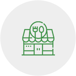 A green line icon of a store with a fork on the roof.