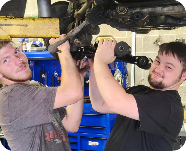 Two mechanics working on a car | Oakmont Service Center