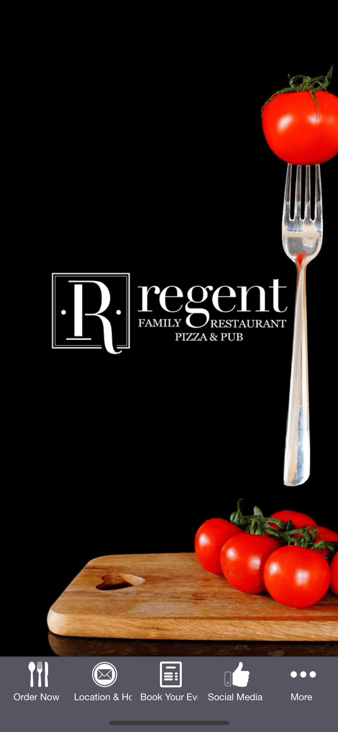 A fork holding a tomato, with other tomatoes on a cutting board. The