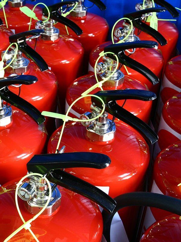 Piled Fire Extinguishers — East-West Fire Services In Garbutt, QLD