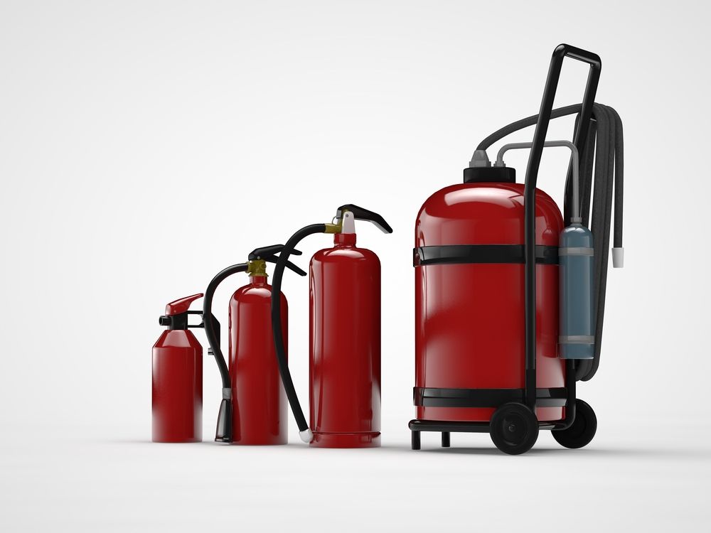 Checking Fire Equipment — East-West Fire Services In Garbutt, QLD