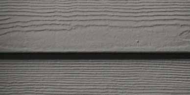Gray horizontal siding with wood grain texture.
