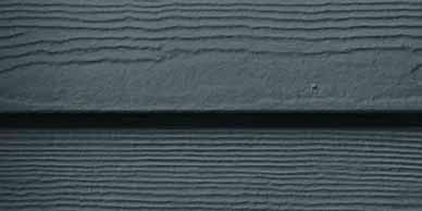 Gray siding with horizontal grooves.