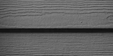 Gray wooden siding with horizontal grooves.