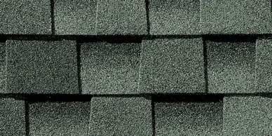 Dark gray asphalt roofing shingles.
