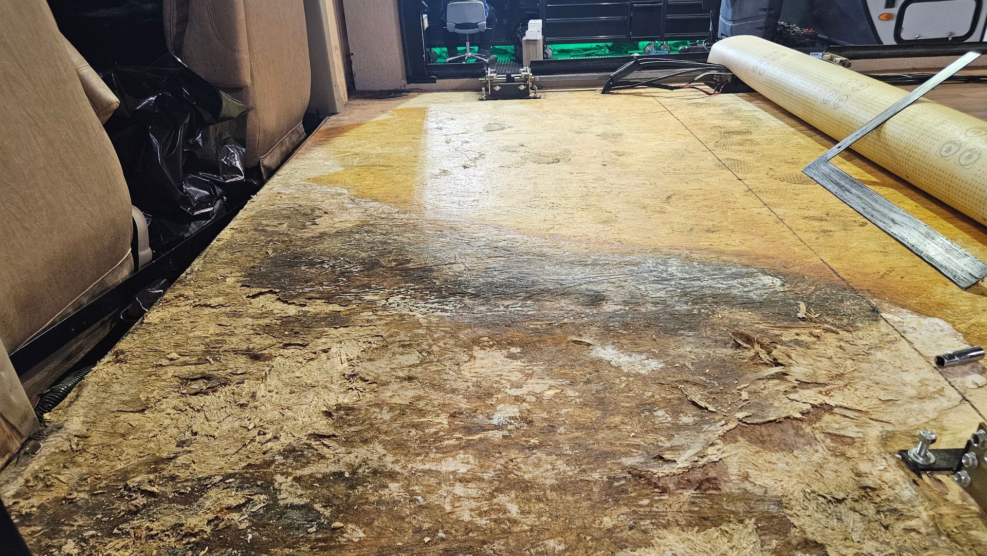 Severe RV slide-out floor damage caused by water entering through the slide-out roof