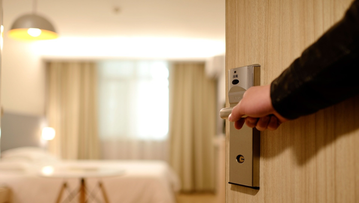 A view of a hotel room through an open door