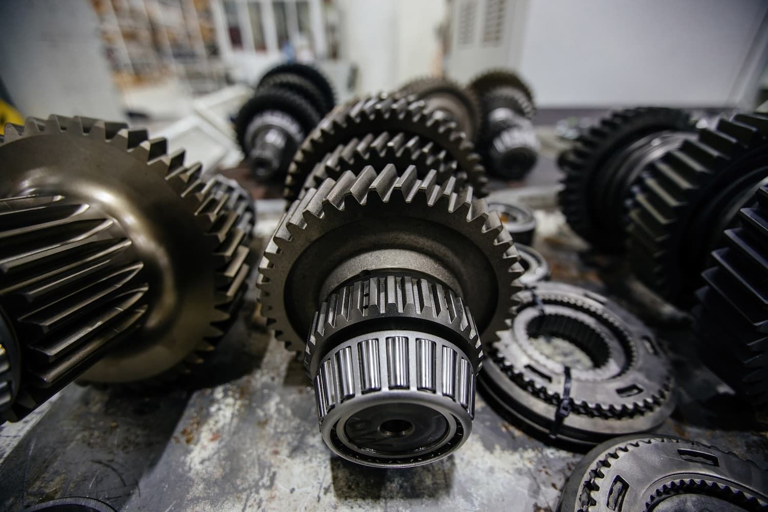 A Bunch of Gears and Bearings Are Laying on a Table — Fosters Ace Auto Repairs In Aitkenvale, QLD