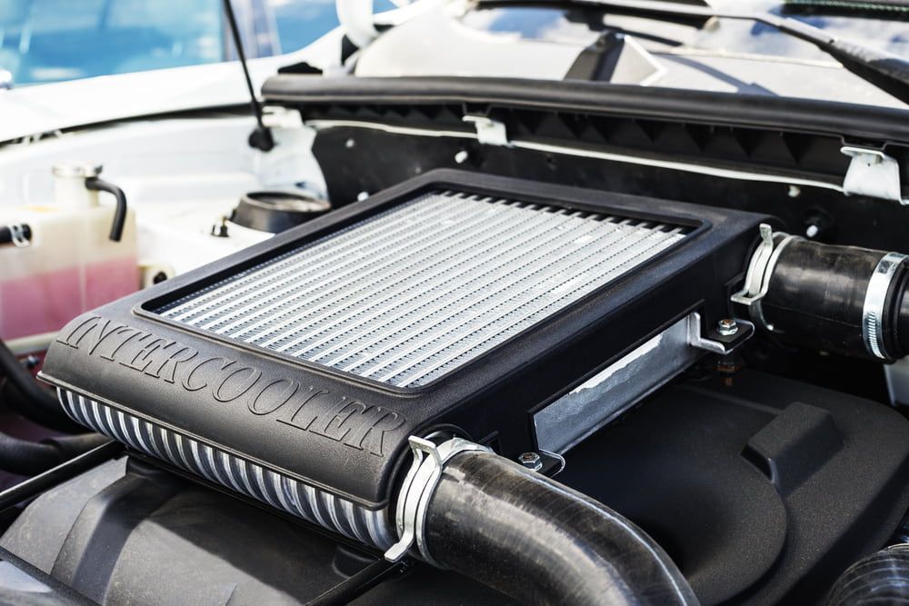 A Close Up of a Car Engine With an Intercooler — Fosters Ace Auto Repairs In Aitkenvale, QLD