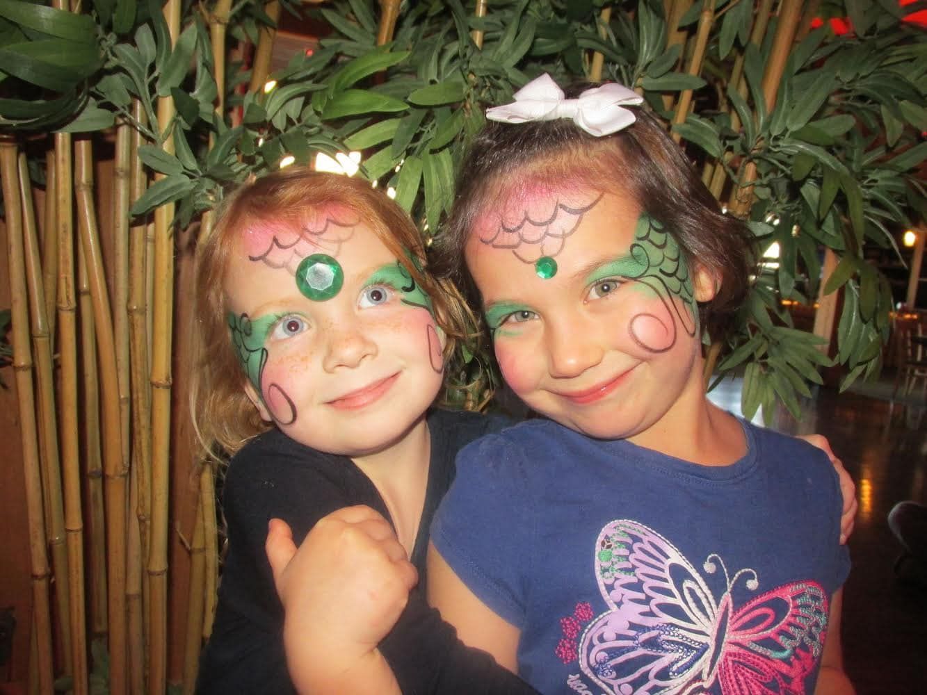2 girls with their faces painted at desaki