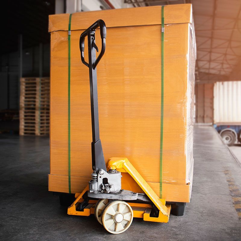 A heavy-looking box on a pallet in a warehouse