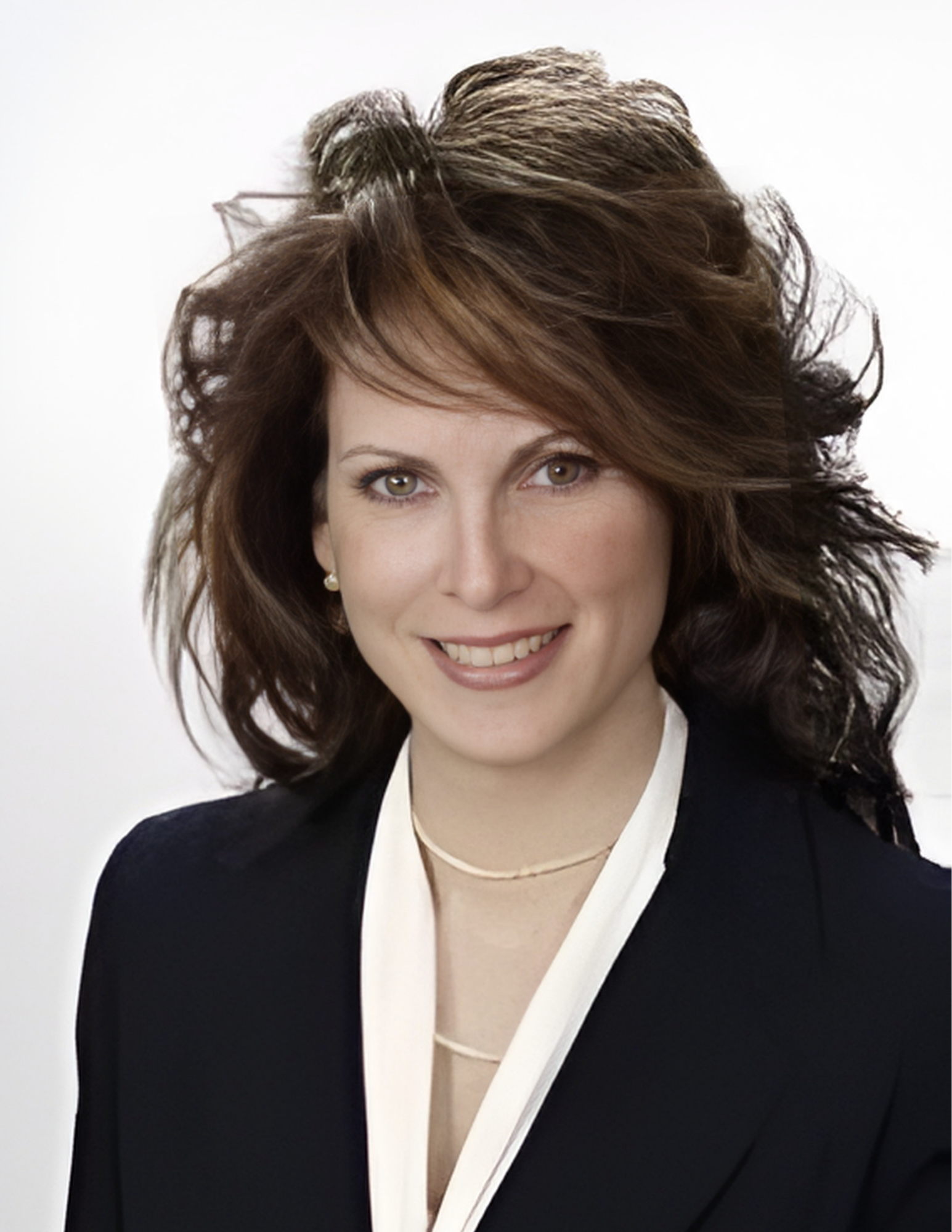 Portrait of a smiling woman with wavy brown hair in a black blazer and white blouse