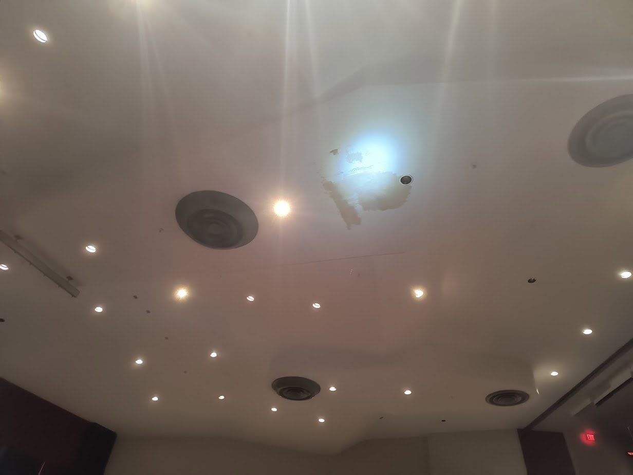 Ceiling water stain showing hidden damage after a Florida storm